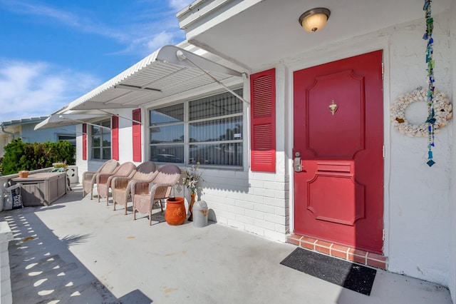 2115 SW 22nd St, Boynton Beach, FL 33426 - view of exterior entry with concrete block siding