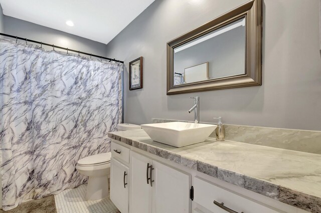 2115 SW 22nd St, Boynton Beach, FL 33426 - full bathroom featuring toilet, vanity, tile patterned flooring, and a shower with shower curtain