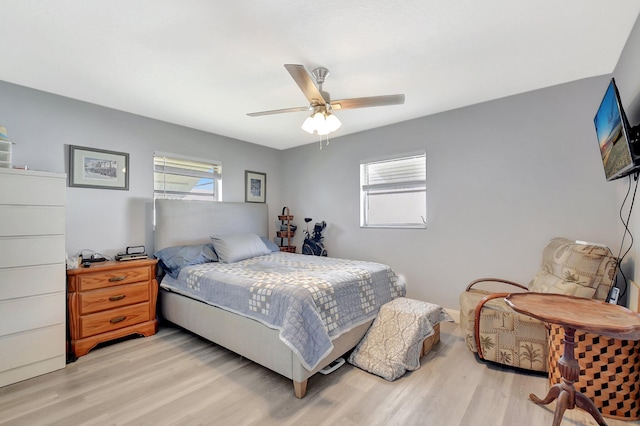 2115 SW 22nd St, Boynton Beach, FL 33426 - bedroom featuring multiple windows, light wood-type flooring, and ceiling fan