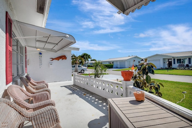 2115 SW 22nd St, Boynton Beach, FL 33426 - view of patio / terrace featuring covered porch and a residential view