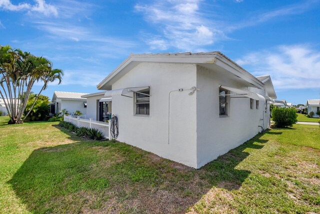 2115 SW 22nd St, Boynton Beach, FL 33426 - view of home's exterior with stucco siding