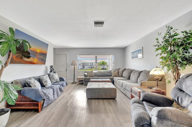 2115 SW 22nd St, Boynton Beach, FL 33426 - living room featuring light wood-type flooring and baseboards