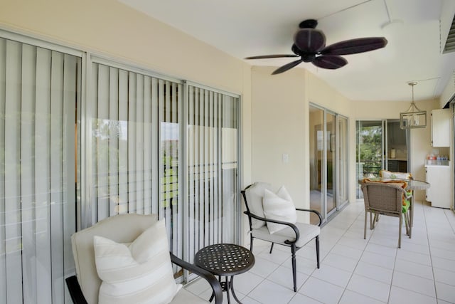 3810 Via Poinciana Unit 401, Lake Worth, FL 33467 - sunroom featuring a ceiling fan and tile patterned floors