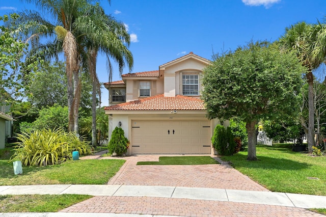 561 Peppergrass Run, Royal Palm Beach, FL 33411 - view of front of home with stucco siding, a tile roof, decorative driveway, a front yard, and a garage