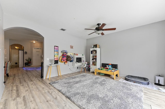 561 Peppergrass Run, Royal Palm Beach, FL 33411 - game room with a ceiling fan, arched walkways, and wood finished floors