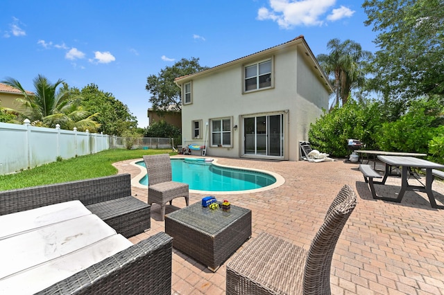 561 Peppergrass Run, Royal Palm Beach, FL 33411 - view of swimming pool with outdoor lounge area, a patio, and a fenced backyard