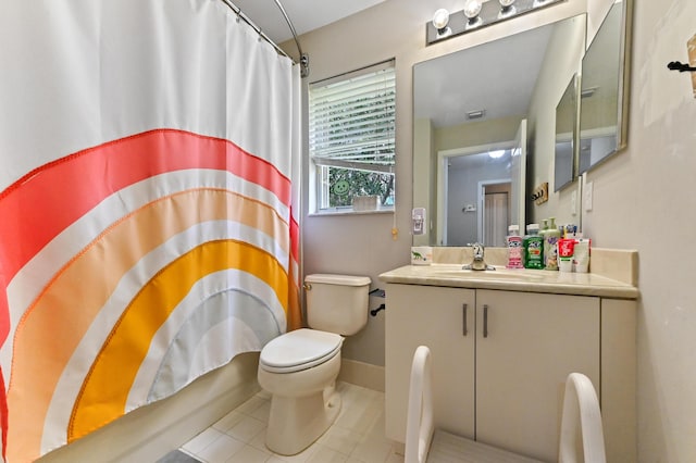 561 Peppergrass Run, Royal Palm Beach, FL 33411 - bathroom with vanity, toilet, tile patterned floors, a shower with curtain, and baseboards