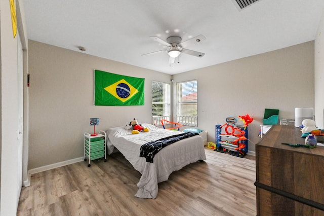 561 Peppergrass Run, Royal Palm Beach, FL 33411 - bedroom featuring wood finished floors, baseboards, and a ceiling fan