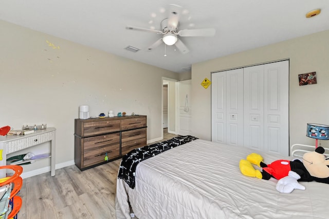 561 Peppergrass Run, Royal Palm Beach, FL 33411 - bedroom featuring light wood-style floors, a closet, baseboards, and ceiling fan