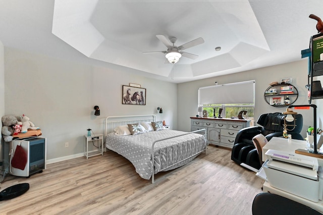 561 Peppergrass Run, Royal Palm Beach, FL 33411 - bedroom with a raised ceiling, wood finished floors, baseboards, and ceiling fan