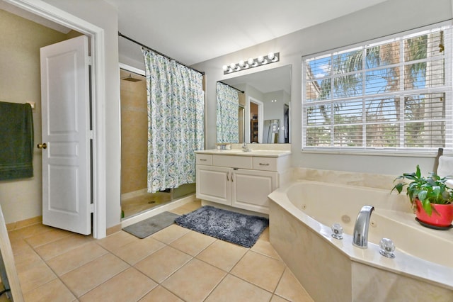 561 Peppergrass Run, Royal Palm Beach, FL 33411 - bathroom featuring a shower stall, vanity, a jetted tub, and tile patterned flooring