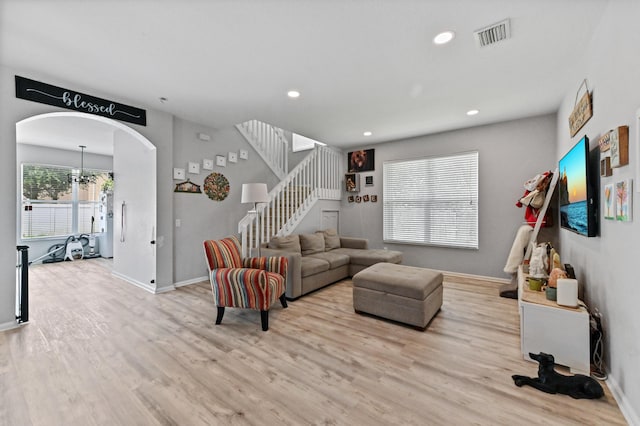 561 Peppergrass Run, Royal Palm Beach, FL 33411 - living room with wood finished floors, stairway, arched walkways, recessed lighting, and baseboards