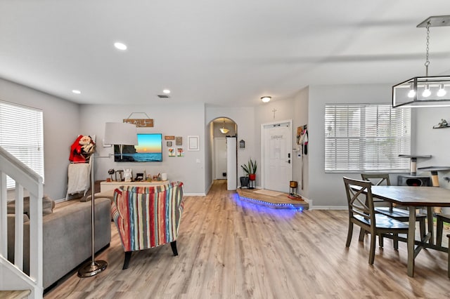 561 Peppergrass Run, Royal Palm Beach, FL 33411 - living room featuring light wood-type flooring, baseboards, arched walkways, and recessed lighting
