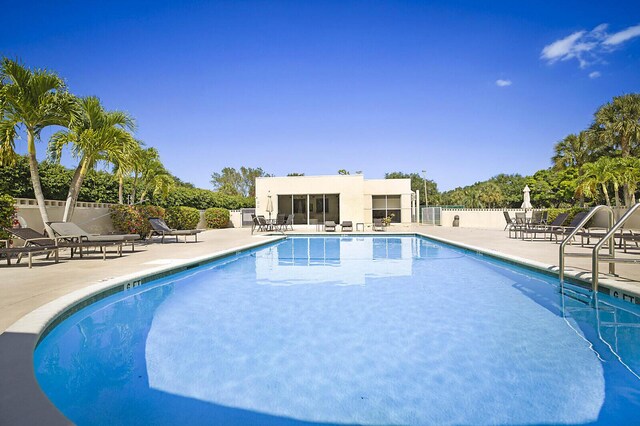 5936 Morningstar Cir Unit 201, Delray Beach, FL 33484 - community pool with fence and a patio