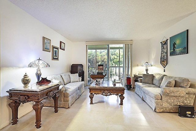 5936 Morningstar Cir Unit 201, Delray Beach, FL 33484 - living area featuring a textured ceiling and light tile patterned flooring