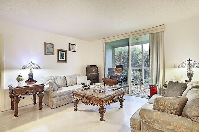 5936 Morningstar Cir Unit 201, Delray Beach, FL 33484 - living area featuring light tile patterned floors and a textured ceiling