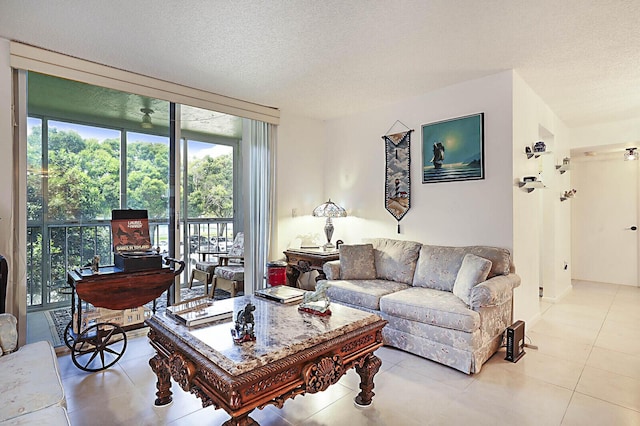 5936 Morningstar Cir Unit 201, Delray Beach, FL 33484 - living area with a textured ceiling and light tile patterned floors