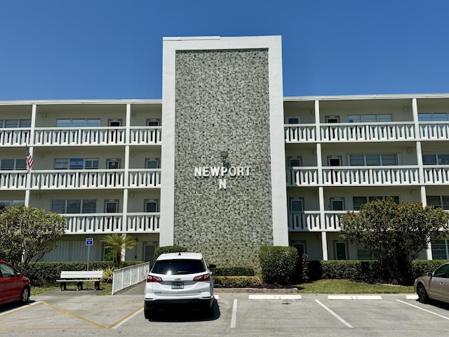 2060 Newport N, Deerfield Beach, FL 33442 - view of apartment building / complex featuring uncovered parking