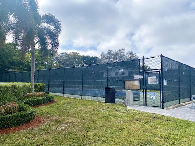 2060 Newport N, Deerfield Beach, FL 33442 - view of tennis court featuring a gate
