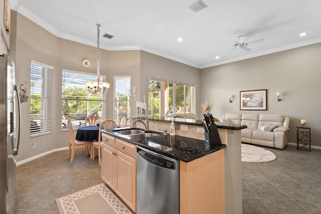 1629 SE Tradition Trce, Stuart, FL 34997 - kitchen featuring appliances with stainless steel finishes, a sink, light brown cabinetry, a chandelier, and dark tile patterned floors