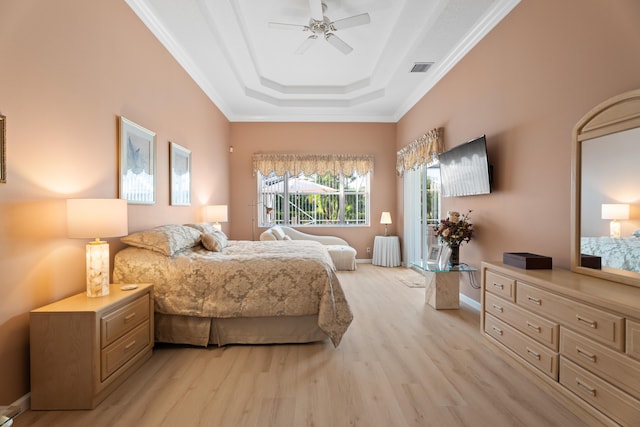 1629 SE Tradition Trce, Stuart, FL 34997 - bedroom with light wood finished floors, a raised ceiling, ornamental molding, ceiling fan, and baseboards