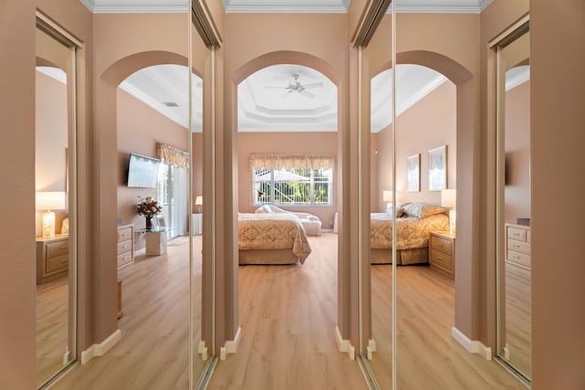 1629 SE Tradition Trce, Stuart, FL 34997 - hall featuring arched walkways, crown molding, and wood finished floors