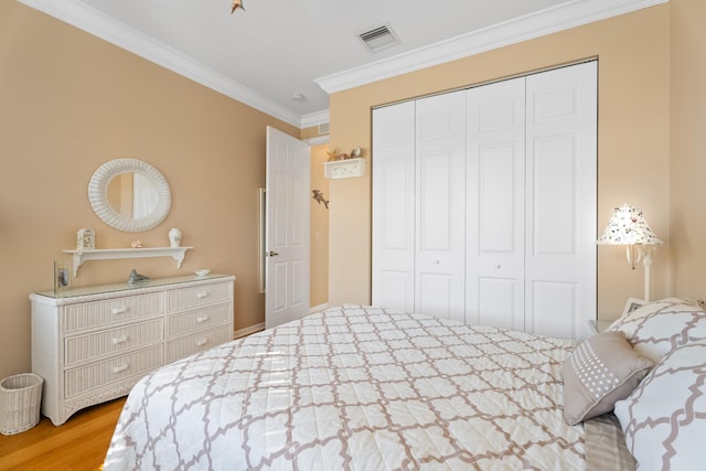 1629 SE Tradition Trce, Stuart, FL 34997 - bedroom featuring ornamental molding, a closet, and wood finished floors