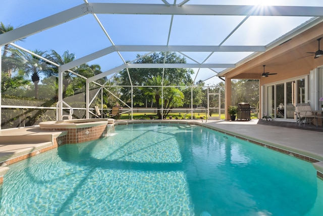 1629 SE Tradition Trce, Stuart, FL 34997 - view of swimming pool featuring ceiling fan, a patio, a grill, a pool with connected hot tub, and a lanai