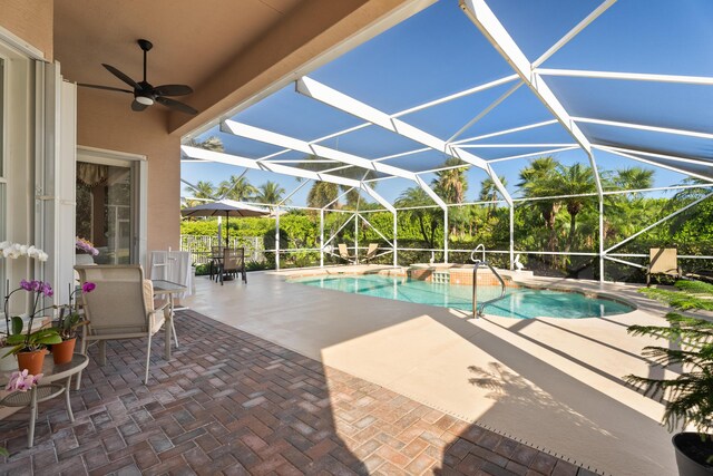 1629 SE Tradition Trce, Stuart, FL 34997 - swimming pool with a patio, ceiling fan, and a lanai