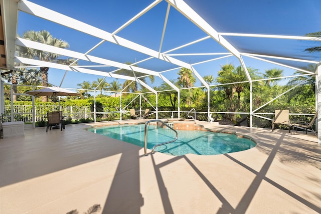 1629 SE Tradition Trce, Stuart, FL 34997 - view of swimming pool featuring a hot tub, a patio area, and a lanai