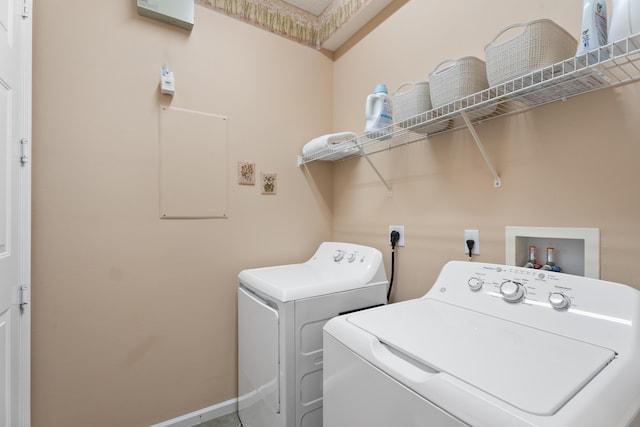 1629 SE Tradition Trce, Stuart, FL 34997 - laundry area featuring washer and clothes dryer and baseboards