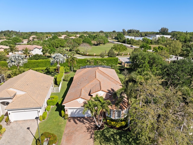 1629 SE Tradition Trce, Stuart, FL 34997 - aerial view of property and surrounding area with a tree filled landscape