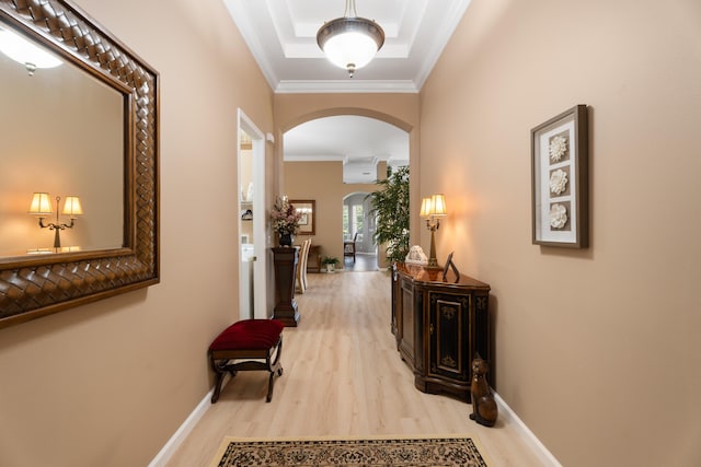 1629 SE Tradition Trce, Stuart, FL 34997 - hallway with arched walkways, wood finished floors, crown molding, and baseboards