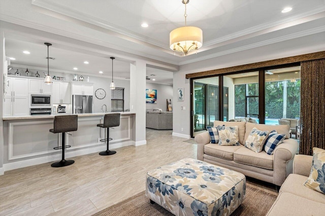 12209 Boca Reserve Ln, Boca Raton, FL 33428 - living room featuring crown molding, baseboards, recessed lighting, and a tray ceiling
