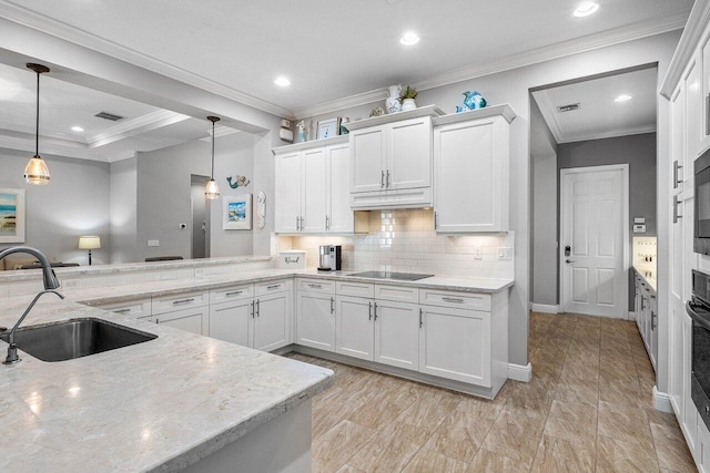 12209 Boca Reserve Ln, Boca Raton, FL 33428 - kitchen with a sink, white cabinets, light stone counters, tasteful backsplash, and decorative light fixtures