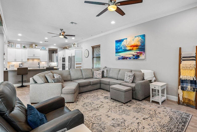 12209 Boca Reserve Ln, Boca Raton, FL 33428 - living area featuring ceiling fan, crown molding, recessed lighting, light wood-style floors, and baseboards
