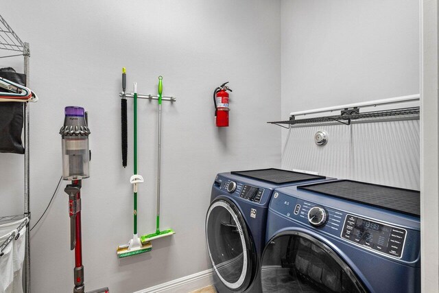 12209 Boca Reserve Ln, Boca Raton, FL 33428 - washroom with washing machine and clothes dryer