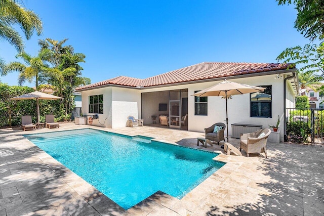 12209 Boca Reserve Ln, Boca Raton, FL 33428 - rear view of house with a tile roof, stucco siding, and a patio area