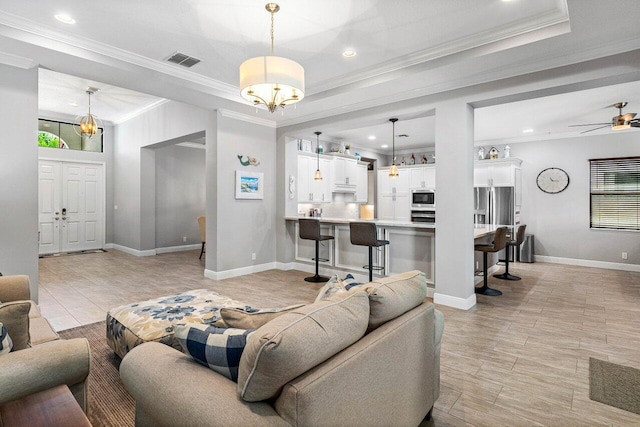 12209 Boca Reserve Ln, Boca Raton, FL 33428 - living room featuring ornamental molding, recessed lighting, ceiling fan, baseboards, and a tray ceiling