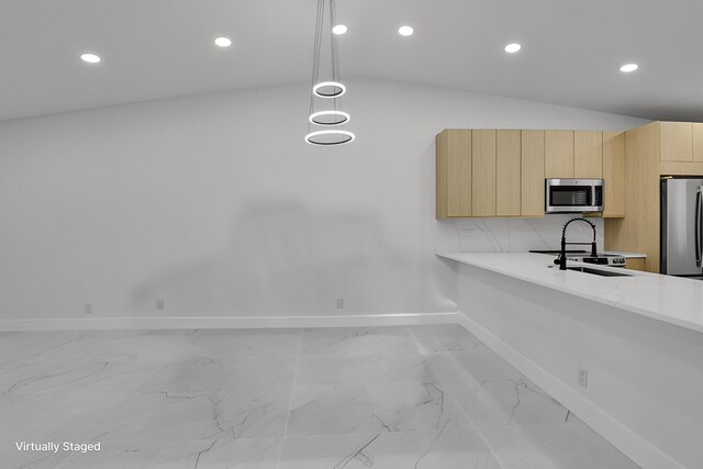 8269 Springtree Rd, Boca Raton, FL 33496 - kitchen with appliances with stainless steel finishes, light brown cabinets, baseboards, light countertops, and light marble finish floors