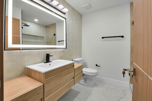 8269 Springtree Rd, Boca Raton, FL 33496 - full bathroom with tile walls, toilet, walk in shower, marble finish floors, and vanity