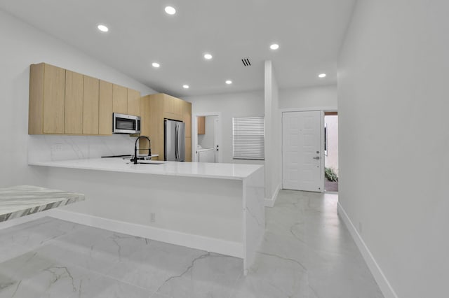 8269 Springtree Rd, Boca Raton, FL 33496 - kitchen with appliances with stainless steel finishes, baseboards, light countertops, and recessed lighting