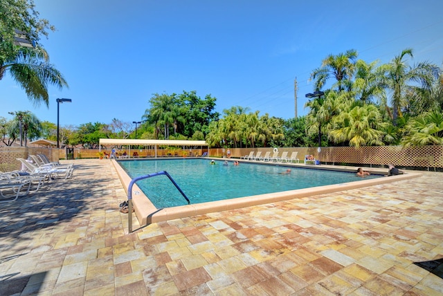 8269 Springtree Rd, Boca Raton, FL 33496 - community pool featuring fence and a patio area