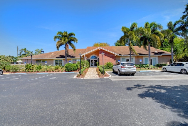 8269 Springtree Rd, Boca Raton, FL 33496 - view of front of property featuring uncovered parking