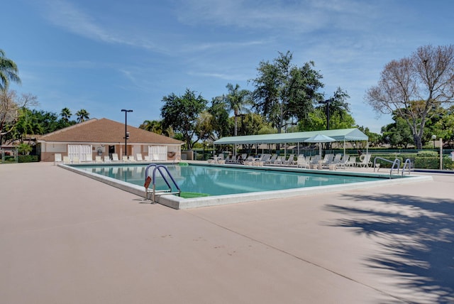 8269 Springtree Rd, Boca Raton, FL 33496 - community pool featuring a patio area and fence