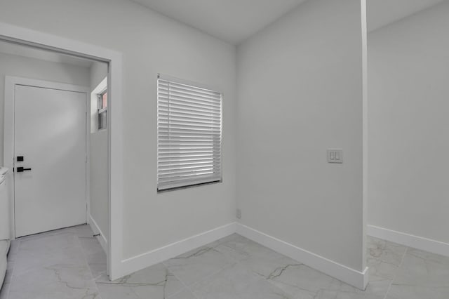 8269 Springtree Rd, Boca Raton, FL 33496 - spare room featuring light marble finish floors and baseboards