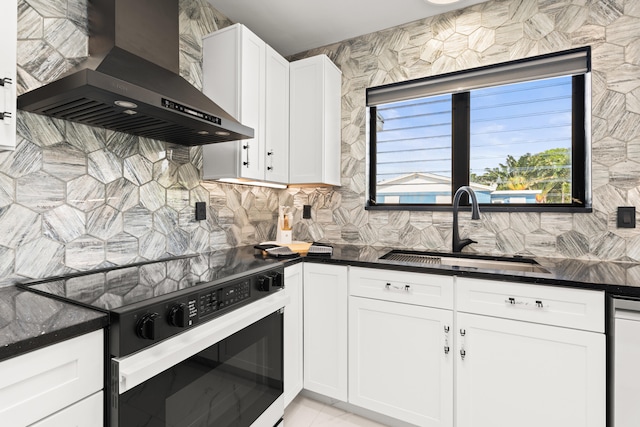 1428 N M St, Lake Worth Beach, FL 33460 - kitchen featuring wall chimney range hood, electric range, a sink, decorative backsplash, and white cabinetry