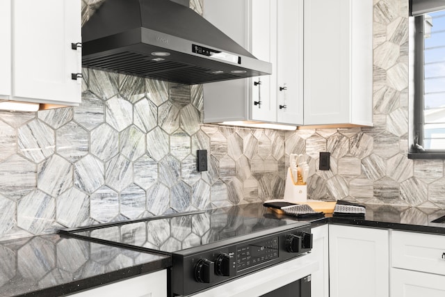 1428 N M St, Lake Worth Beach, FL 33460 - kitchen featuring range hood, stove, dark countertops, white cabinets, and tasteful backsplash
