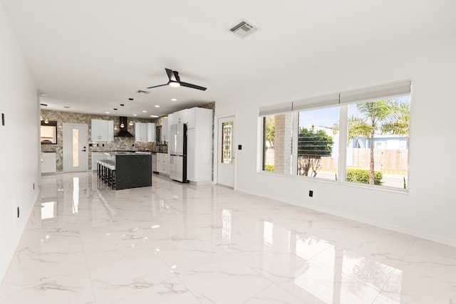 1428 N M St, Lake Worth Beach, FL 33460 - unfurnished living room featuring light marble finish flooring, ceiling fan, baseboards, and recessed lighting