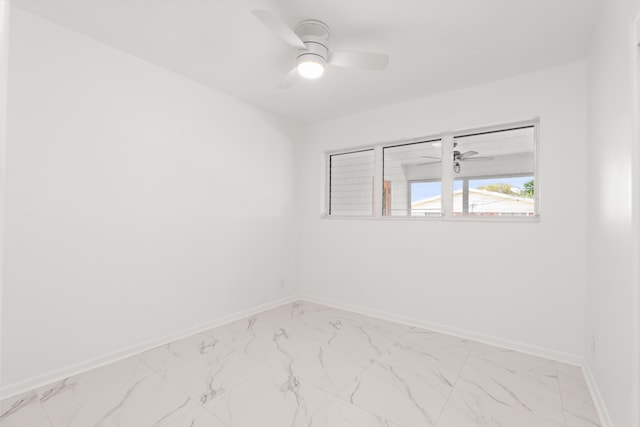 1428 N M St, Lake Worth Beach, FL 33460 - unfurnished room with light marble finish floors, baseboards, and a ceiling fan